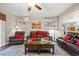 Living room with hardwood floors, fireplace, and leather furniture at 7220 Elderly Ave, Las Vegas, NV 89131