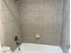 Shower/tub combo with neutral tile at 730 Oakmont Ave # 904, Las Vegas, NV 89109