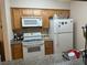 Bright kitchen, white appliances, ample wood cabinetry at 730 Oakmont Ave # 904, Las Vegas, NV 89109