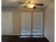 Living room with carpet, ceiling fan and door at 730 Oakmont Ave # 904, Las Vegas, NV 89109