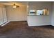 Living room with carpet, ceiling fan and kitchen bar at 730 Oakmont Ave # 904, Las Vegas, NV 89109