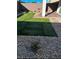 Landscaped backyard with artificial turf and gravel at 7883 Bethel Heights Ln, Las Vegas, NV 89113