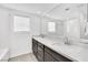 Bathroom with double vanity and a large mirror at 7883 Bethel Heights Ln, Las Vegas, NV 89113