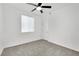 Bright bedroom with ceiling fan and carpet flooring at 7883 Bethel Heights Ln, Las Vegas, NV 89113