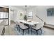 Modern dining room with marble table and statement lighting at 7883 Bethel Heights Ln, Las Vegas, NV 89113