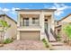 Modern two-story house with balcony and brick driveway at 7883 Bethel Heights Ln, Las Vegas, NV 89113