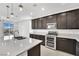 Modern kitchen with stainless steel appliances and an island at 7883 Bethel Heights Ln, Las Vegas, NV 89113