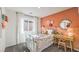 Charming bedroom with coral walls and a metal bed frame at 791 Ruby Sedona Ave, North Las Vegas, NV 89081