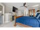 Spacious main bedroom with large TV, fireplace, and access to patio at 7944 Marbella Cir, Las Vegas, NV 89128