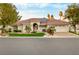 Single-story home with tile roof, solar panels, and landscaped front yard at 7944 Marbella Cir, Las Vegas, NV 89128