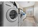 Laundry room with washer, dryer, and window for ventilation at 7944 Marbella Cir, Las Vegas, NV 89128