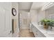 Bathroom featuring double sinks with a decorative plant on the marble countertop at 830 Carnegie St # 1821, Henderson, NV 89052