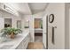 Bathroom featuring double sinks with a decorative plant on the marble countertop at 830 Carnegie St # 1821, Henderson, NV 89052