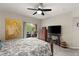 Bright bedroom with king bed, private balcony access, and ceiling fan at 830 Carnegie St # 1821, Henderson, NV 89052