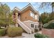 Inviting two-story condo with desert landscaping and stucco exterior with exterior stairs leading to the front door at 830 Carnegie St # 1821, Henderson, NV 89052