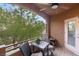 Private patio with seating area and treetop views at 830 Carnegie St # 1821, Henderson, NV 89052