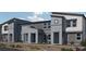 Modern townhomes with gray and blue exterior at 9449 Peaceful River Ave # Lot 18, Las Vegas, NV 89178