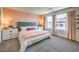 Spacious main bedroom with light color scheme and stylish bedding at 9449 Peaceful River Ave # Lot 18, Las Vegas, NV 89178