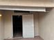 View of backyard with access door and tiled patio at 9712 Tiaquinn Ave # 101, Las Vegas, NV 89129