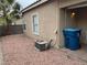 Small backyard with gravel landscaping and AC unit at 9712 Tiaquinn Ave # 101, Las Vegas, NV 89129