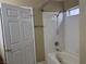 Bathroom with shower/tub combo and tile surround at 9712 Tiaquinn Ave # 101, Las Vegas, NV 89129