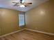 Bright bedroom with ceiling fan and luxury vinyl plank flooring at 9712 Tiaquinn Ave # 101, Las Vegas, NV 89129