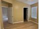 Spacious bedroom with luxury vinyl plank flooring and access to bathroom at 9712 Tiaquinn Ave # 101, Las Vegas, NV 89129