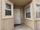 Front door entryway with decorative security door and a welcome mat at 9712 Tiaquinn Ave # 101, Las Vegas, NV 89129