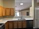 Kitchen with stainless steel appliances and wood cabinets at 9712 Tiaquinn Ave # 101, Las Vegas, NV 89129