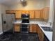 Kitchen with stainless steel appliances and wood cabinets at 9712 Tiaquinn Ave # 101, Las Vegas, NV 89129