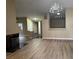 Spacious living room with hardwood floors and a fireplace at 9712 Tiaquinn Ave # 101, Las Vegas, NV 89129