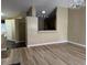 Living room with hardwood floors and a breakfast bar at 9712 Tiaquinn Ave # 101, Las Vegas, NV 89129