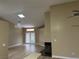 Spacious living room with fireplace and chandelier at 9712 Tiaquinn Ave # 101, Las Vegas, NV 89129