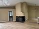 Living room with a fireplace and hardwood floors at 9712 Tiaquinn Ave # 101, Las Vegas, NV 89129