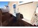 Backyard featuring desert landscaping, AC unit, and stucco exterior at 1025 Chestnut Bay Ave, North Las Vegas, NV 89031