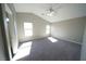 Bedroom featuring neutral walls, carpeted floors, bright light, and a ceiling fan at 1025 Chestnut Bay Ave, North Las Vegas, NV 89031