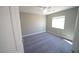 Neutral bedroom with carpeted floor, bright natural light, and a ceiling fan at 1025 Chestnut Bay Ave, North Las Vegas, NV 89031