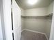 The walk-in closet has white shelving and carpeted flooring at 1025 Chestnut Bay Ave, North Las Vegas, NV 89031