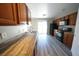 Updated kitchen features stainless steel appliances, stone countertops, and modern cabinets at 1025 Chestnut Bay Ave, North Las Vegas, NV 89031