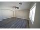 Comfortable living room with large window and ceiling fan at 1025 Chestnut Bay Ave, North Las Vegas, NV 89031