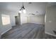 Spacious living room with new floors and a ceiling fan at 1025 Chestnut Bay Ave, North Las Vegas, NV 89031