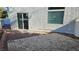 Small back patio with gravel and a paved area at 10337 Adams Chase St, Las Vegas, NV 89183