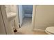 Small bathroom with pedestal sink and toilet at 10337 Adams Chase St, Las Vegas, NV 89183