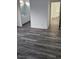 Stylish bathroom featuring wood flooring, a double sink vanity, and ample natural light at 10337 Adams Chase St, Las Vegas, NV 89183