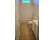 Bright full bathroom featuring tile floors and shower-over-tub at 10337 Adams Chase St, Las Vegas, NV 89183
