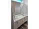 Double vanity bathroom with large mirror at 10337 Adams Chase St, Las Vegas, NV 89183