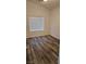 Bright bedroom with wood-look flooring and window blinds at 10337 Adams Chase St, Las Vegas, NV 89183
