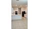 Bright kitchen featuring white cabinetry, tile floors, and modern appliances, perfect for cooking and entertaining at 10337 Adams Chase St, Las Vegas, NV 89183