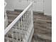 White staircase with wood-look flooring at 10337 Adams Chase St, Las Vegas, NV 89183