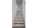 Upper level staircase with white railings at 10337 Adams Chase St, Las Vegas, NV 89183